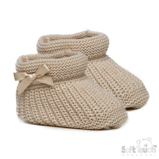 Unisex Newborn Clothes - Baby booties with a biscuit coloured knitted design, featuring a small bow on the side. (Front Angle)