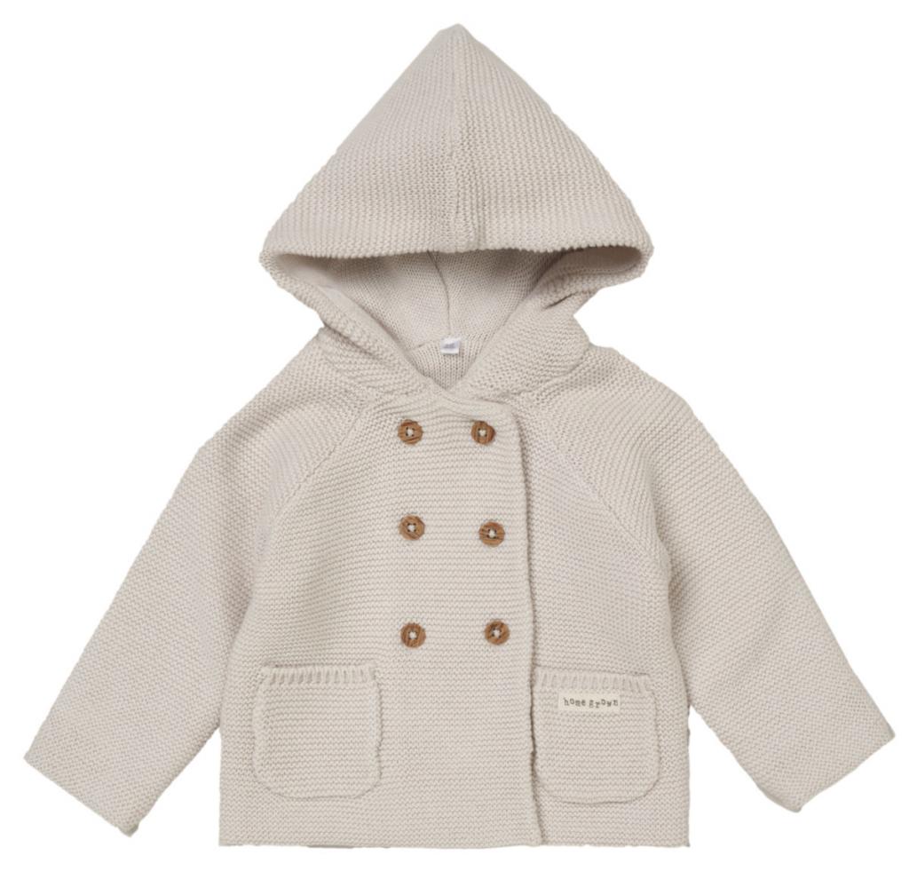 Baby cardigan, knitted in beige organic cotton. Features an adorable hood, double breasted wooden button fastenings and two pockets for practicality. 