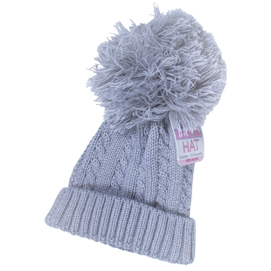 Unisex Baby Clothes - Grey cable knit baby hat with a fluffy grey pom pom on top, showcasing its cosy and stylish design for keeping babies warm and fashionable