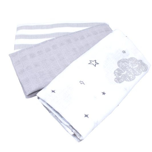 Three soft muslin squares in neutral tones of grey and white, made from 100% cotton fabric for gentle comfort. Ideal for swaddling, burping, and various baby care needs